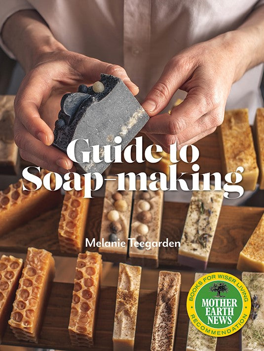 Mother Earth News Guide to Soap-Making book cover showing title and illustrations related to soap craft and natural ingredients.