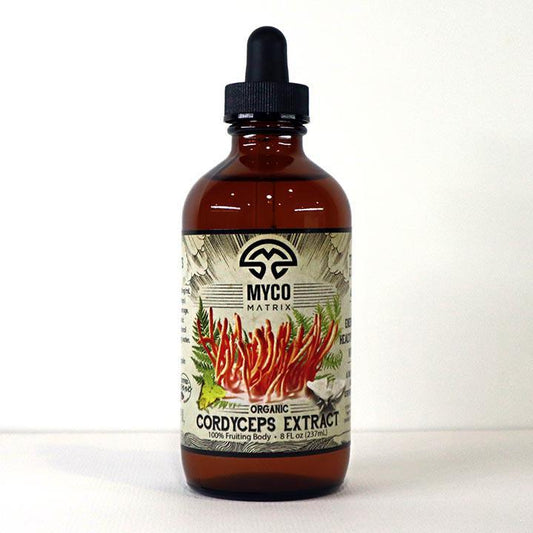 Mycomatrix Cordyceps adaptogenic mushroom extract from Mushroom Mountain in a 2oz bottle, featuring fresh mushroom imagery.