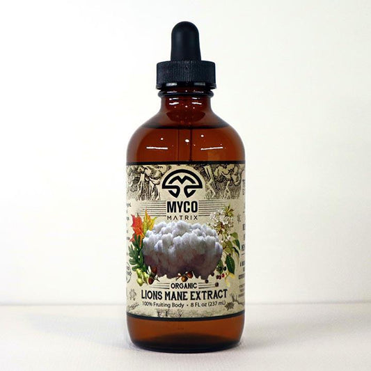 Mycomatrix Lions Mane adaptogenic mushroom extract in a 2oz bottle, featuring fresh Lions Mane mushrooms from Mushroom Mountain.
