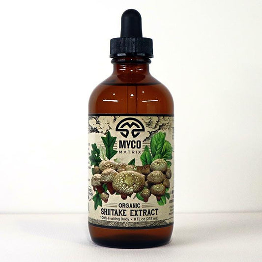 Mycomatrix Shiitake adaptogenic mushroom extract in a 2oz bottle from Mushroom Mountain, featuring a label with mushrooms and natural ingredients.