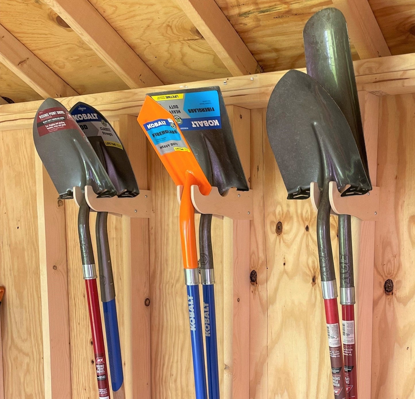 HangThis Up complete shed organization kit with garden tool rack, hooks, and shelving for outdoor yard and garden tool storage.