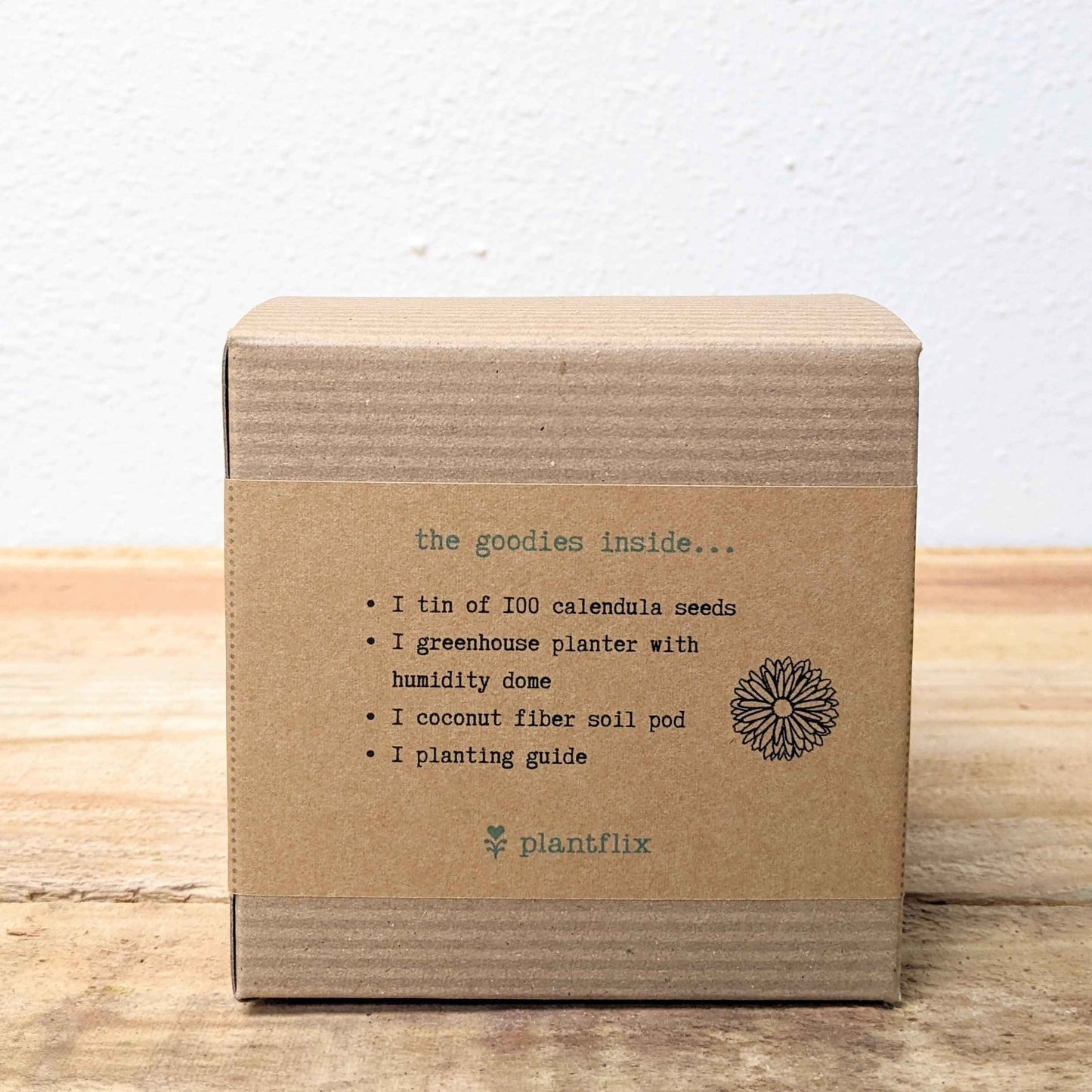 Calendula herb seeds in a beginner grow kit from Plantflix, featuring seed packets and planting supplies for easy gardening.