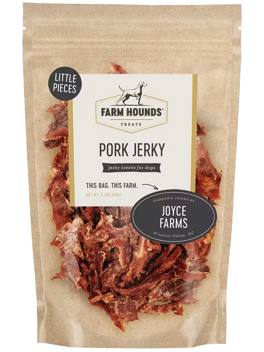 Farm Hounds pork jerky in small pieces, showing the savory, dried pork snack with a textured surface and natural color.
