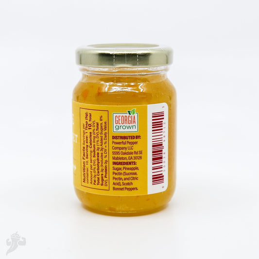 Pineapple Scotch Bonnet Chili Jam by Powerful Pepper Company, showcasing a jar of spicy, fruity jam with chunks of pineapple and chili peppers