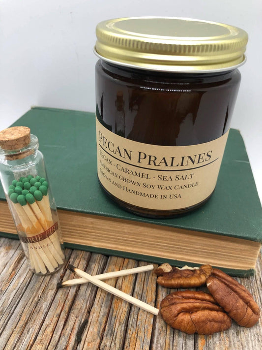 Pecan Pralines soy wax candle in a 9 oz amber apothecary jar by Prairie Fire Tallow, Candles, and Lavender.