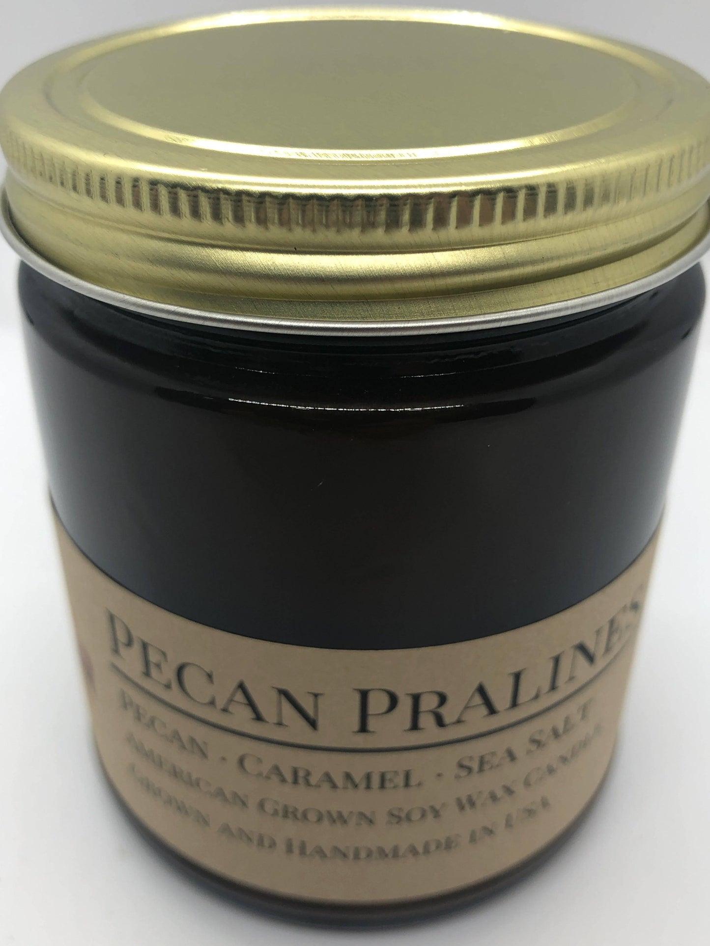Pecan Pralines soy wax candle in a 9 oz amber apothecary jar from Prairie Fire Tallow, Candles, and Lavender.