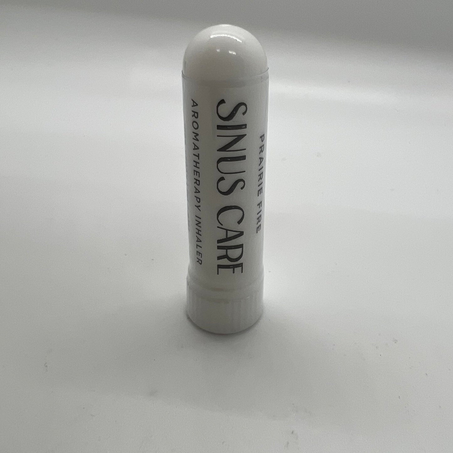 Prairie Fire Tallow Sinuscare Aromatherapy Inhaler with lavender scent, featuring a small portable inhaler for sinus relief.