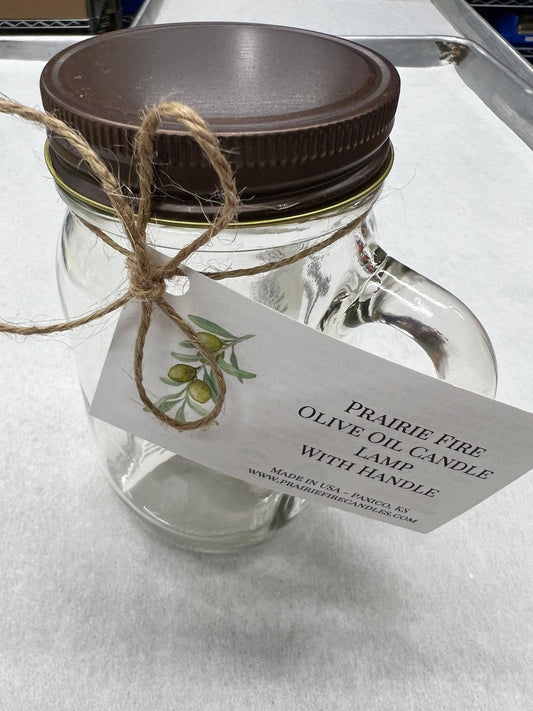 Olive oil candle lamp in a handle mason jar by Prairie Fire Tallow, ideal as an emergency backup during power outages.