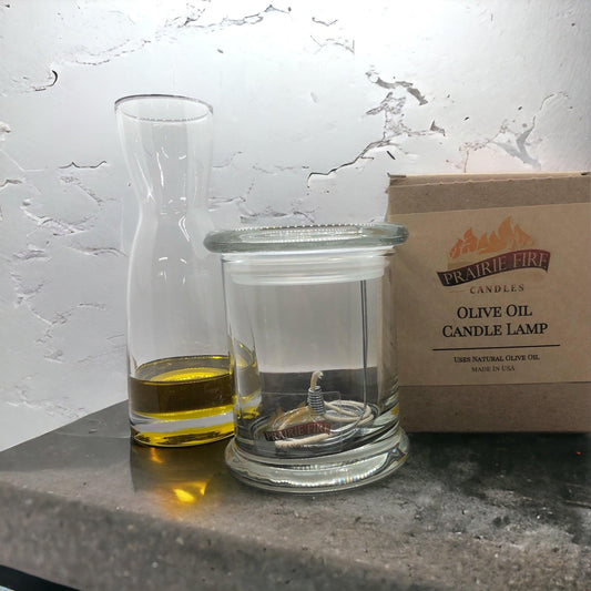 Olive oil candle lamp by Prairie Fire Tallow, Candles, and Lavender, used as emergency backup during power outages.
