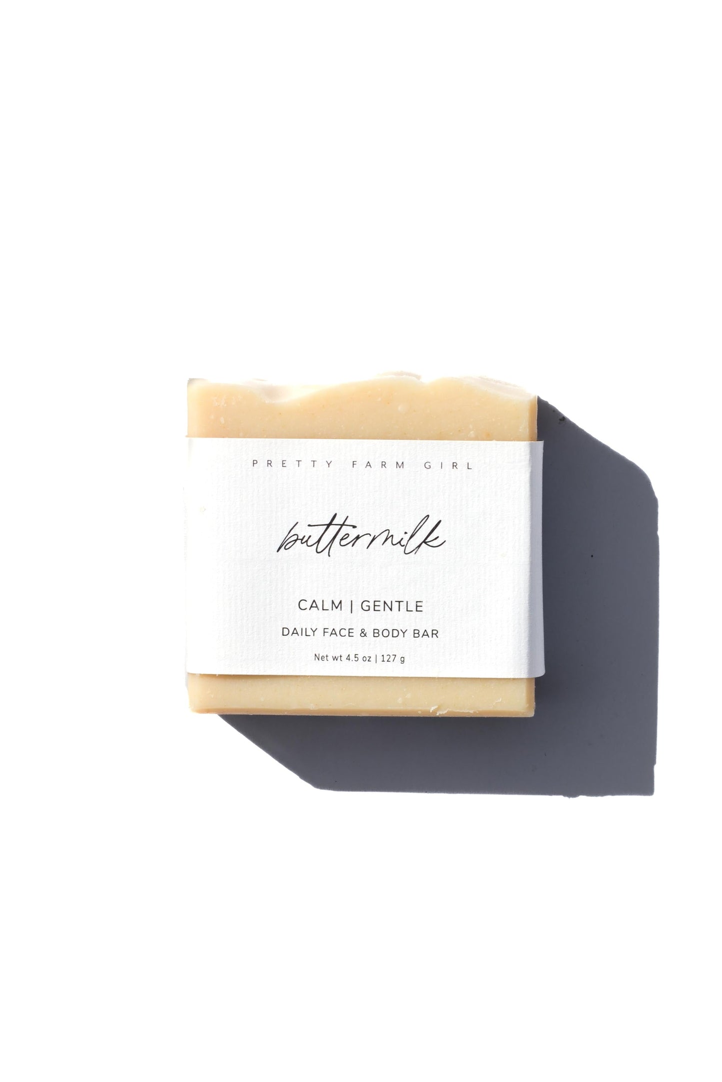 Three fragrance-free handmade soap bars by Pretty Farm Girl, made with tallow and goat milk, displayed in a natural setting.