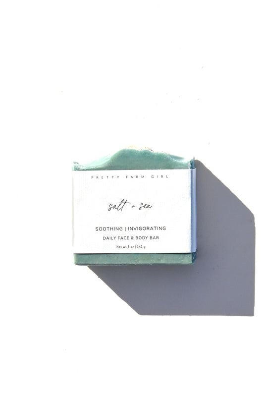 Handmade Salt + Sea Bar soap by Pretty Farm Girl, featuring tallow and goat milk, shown as a rustic bar with natural ingredients.