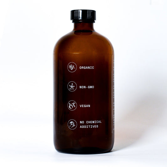 Pure organic castor oil from Pretty Farm Girl, 16 oz, cold-pressed, hexane-free essential oil in a clear glass bottle.