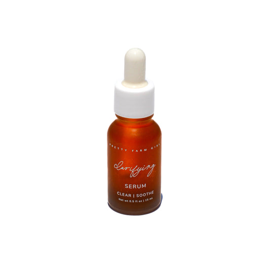 Pretty Farm Girl clarifying face serum for acne-prone skin, featuring a sleek bottle with a dropper applicator.