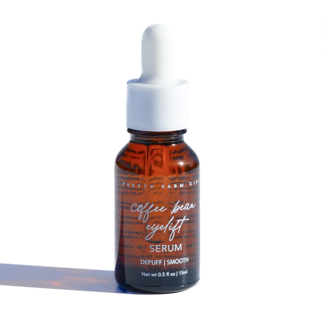 Pretty Farm Girl Coffee Bean Eye Lift Serum in a sleek face serum bottle, designed to reduce puffiness and dark circles around the eyes.