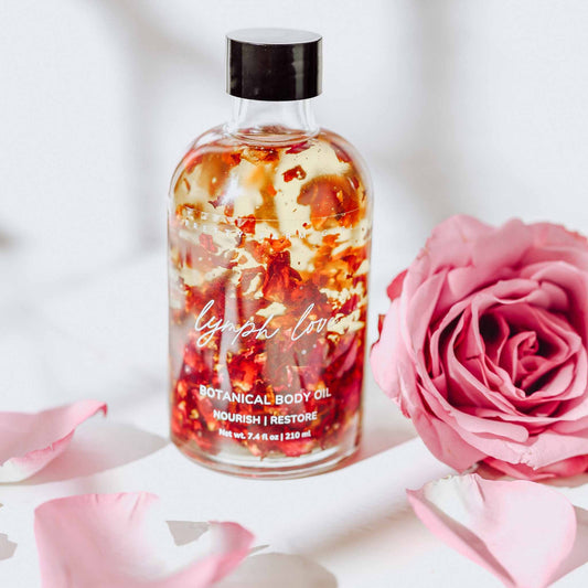 Pretty Farm Girl Lymph Love Natural Body Oil for lymphatic massages, showing a bottle of health and beauty body oil.