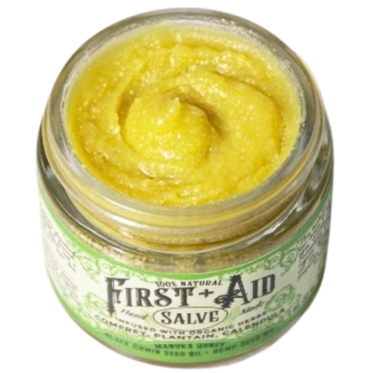 Roots and Leaves LLC First Aid Salve in a jar, natural body care product with herbal ingredients for skin soothing and healing.