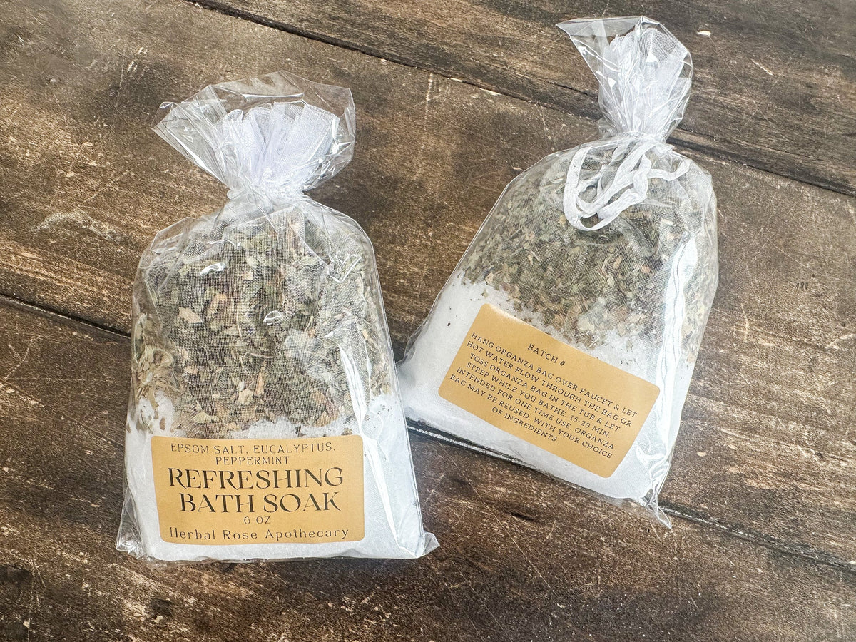 Herbal Rose Apothecary herbal bath soak with dried herbs and floral accents in a white bowl, ready for a relaxing bath.