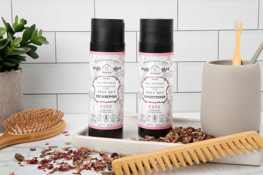 All-natural Soapnut shampoo and conditioner set by Roots and Leaves LLC with rose scent and wild fermented probiotics for scalp health.