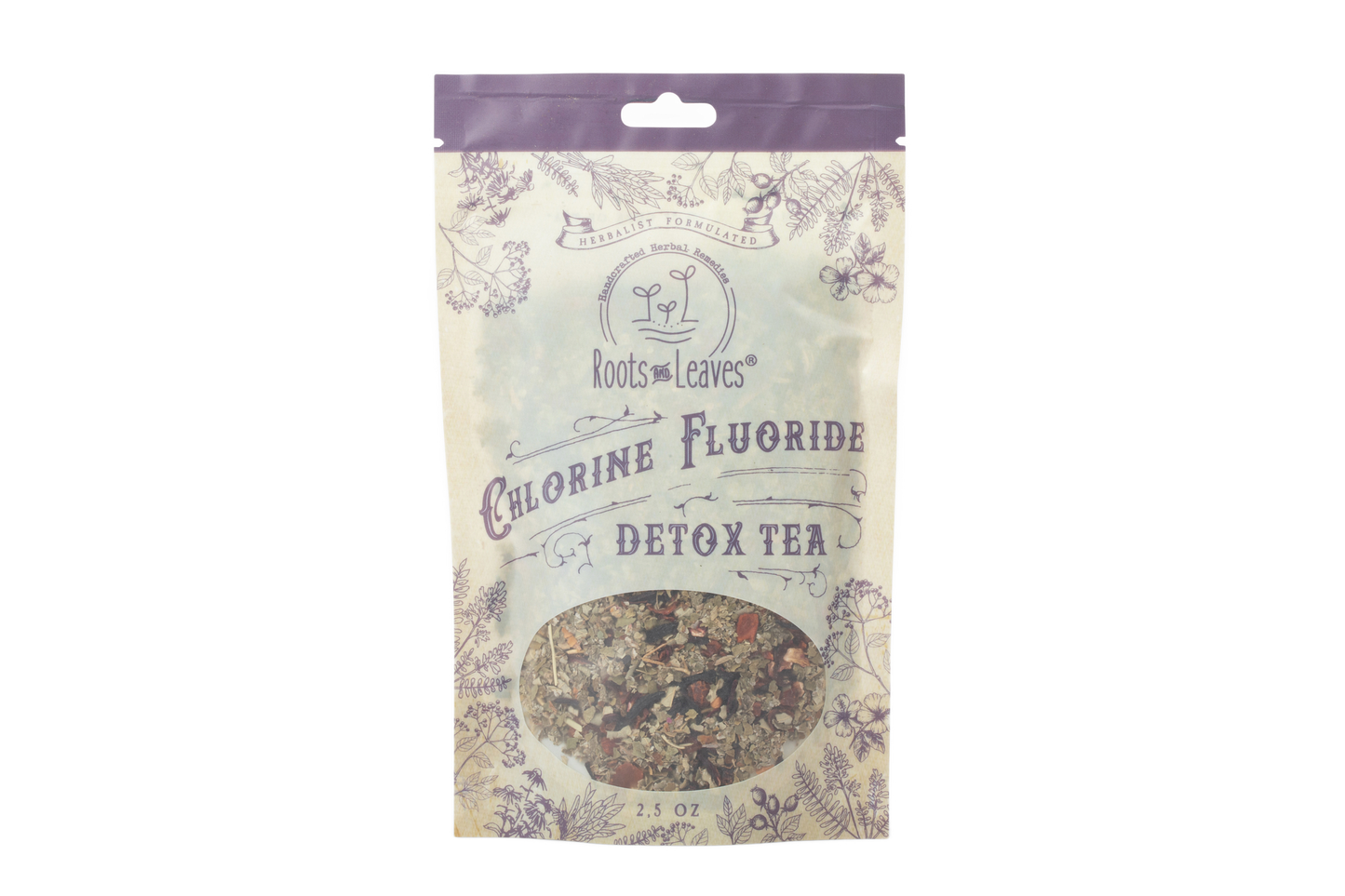 Roots and Leaves LLC Chlorine and Fluoride Detox Tea in a clear glass mug with tea leaves and lemon slices.