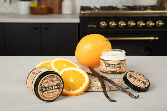 Creamy tallow balm with creamsicle scent by Roots and Leaves LLC, showing the soothing balm in a jar