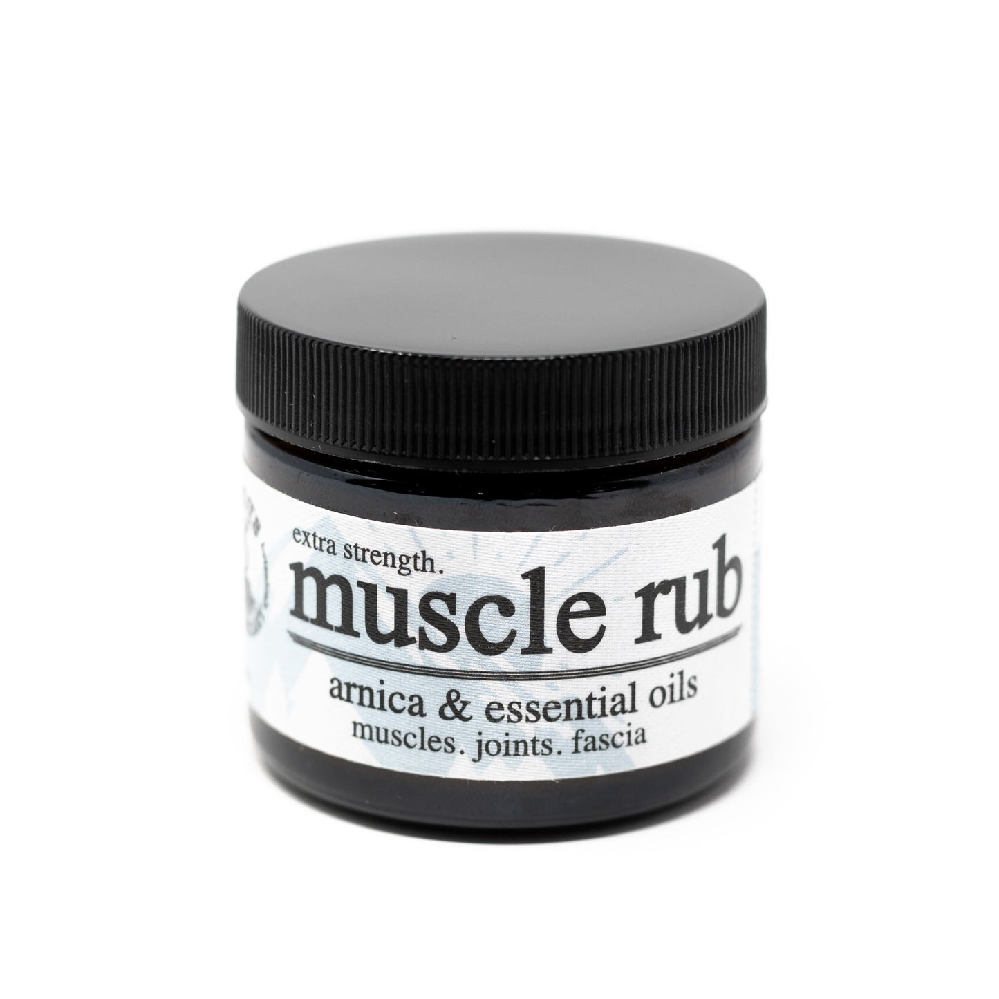 Roots Apothecary muscle rub with arnica and essential oils, shown in a jar with natural ingredients for soothing muscle relief.