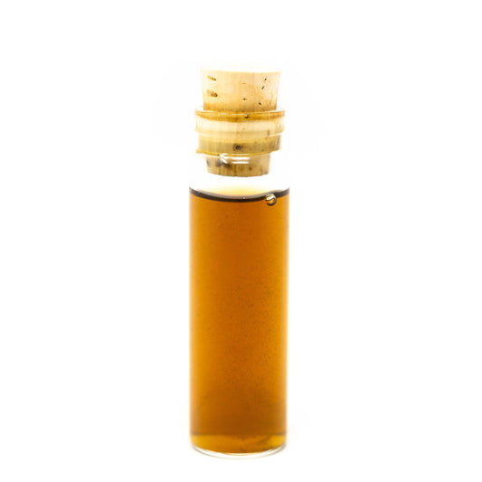 Roots Apothecary detox tincture in a glass dropper bottle, featuring herbal ingredients for cleansing and wellness.
