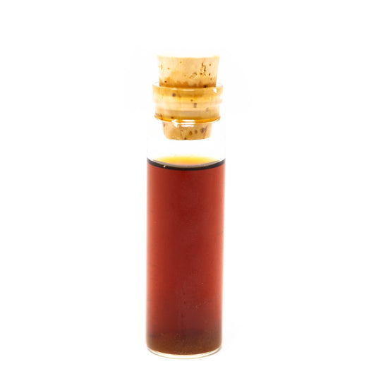Roots Apothecary energy tincture bottle with dropper, featuring herbal ingredients in a glass container.
