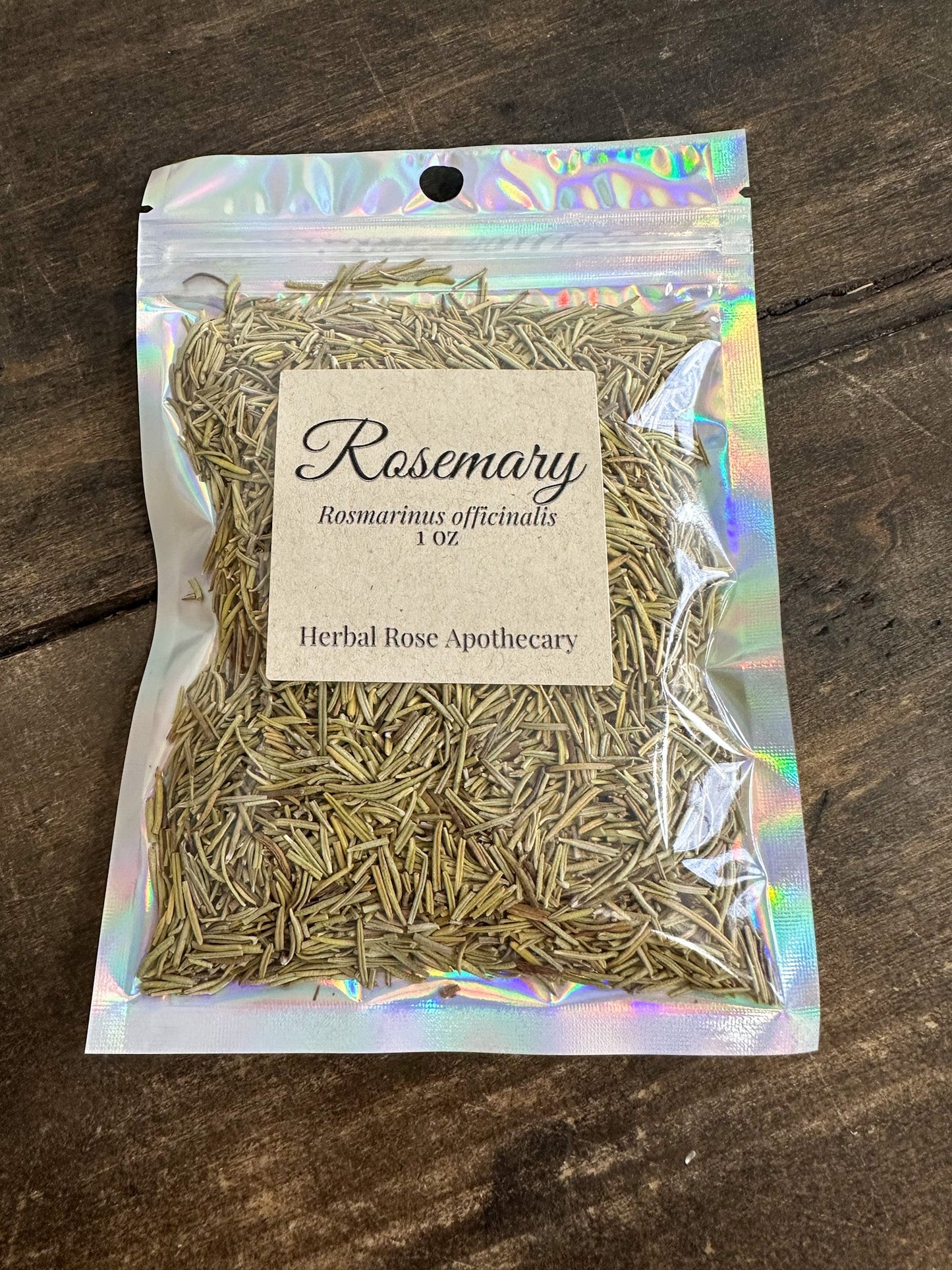 Dried rosemary herb in a 1oz package from herbalroseapothecary, showcasing fresh green rosemary sprigs and leaves.