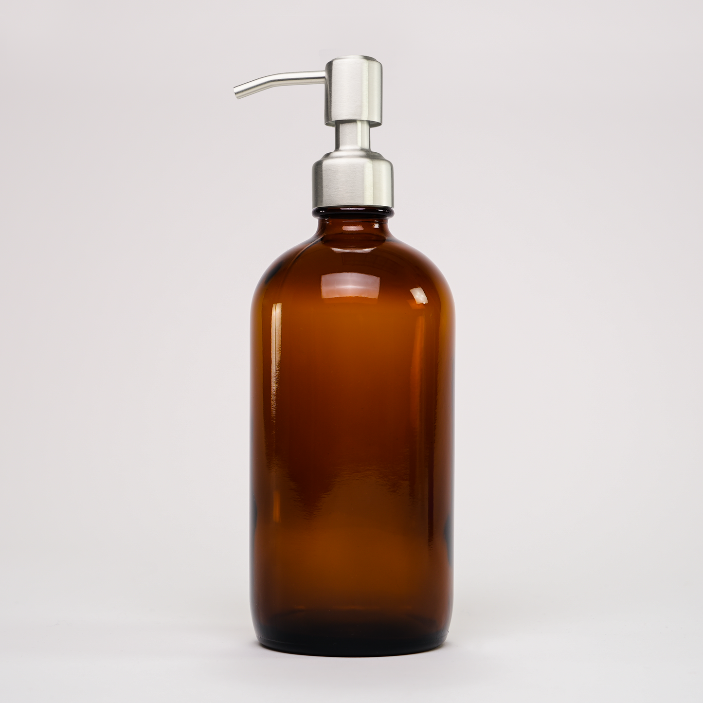 16 oz amber glass keeper bottle with stainless steel pump for home and garden use, by Rustic Strength.