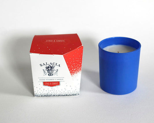 Salacia Salts Citrus & Sunrays hand-poured soy blend candle with a white jar and a bright citrus and sunrays label.