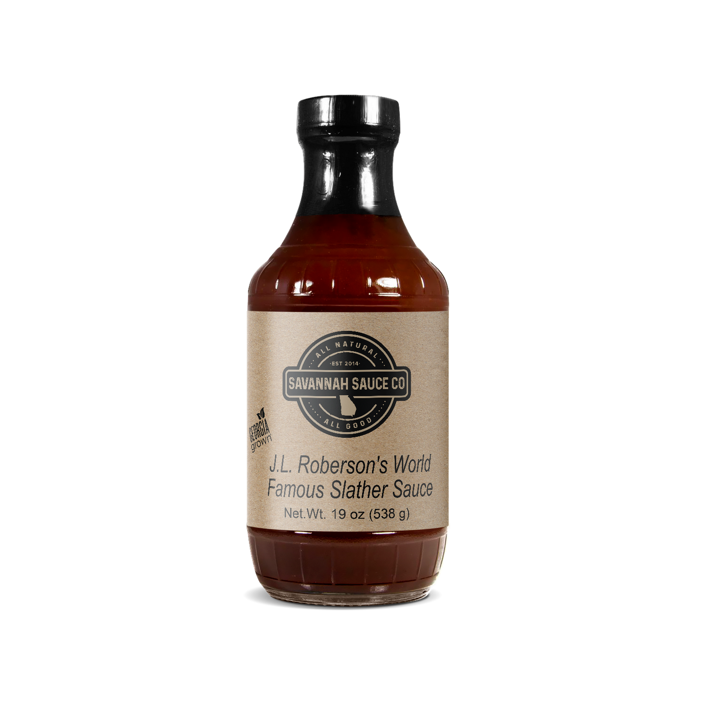 A 19 oz (538g) glass bottle of SavannahSauceCompany J.L. Roberson’s World Famous Slather Sauce features natural hickory-smoked dark brown sauce, a beige label, and a black cap.