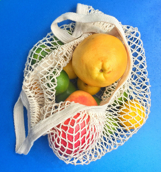 French Market Tote by Seattle Seed Company, cotton string bag with sturdy handles and spacious interior for shopping or carrying items.