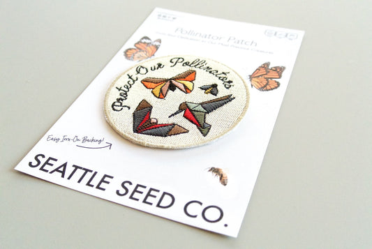 Pollinator Pride patch and sticker kit from Seattle Seed Company featuring colorful bee and flower designs for pollinator awareness.