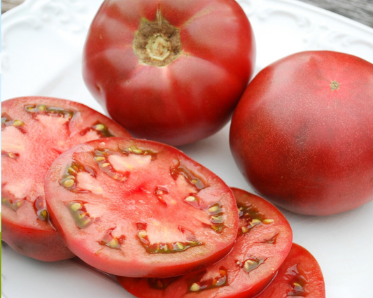 Packet of Seeds 'n Such Cherokee Purple Tomato Seeds showing 30 seeds in a colorful packet for planting.