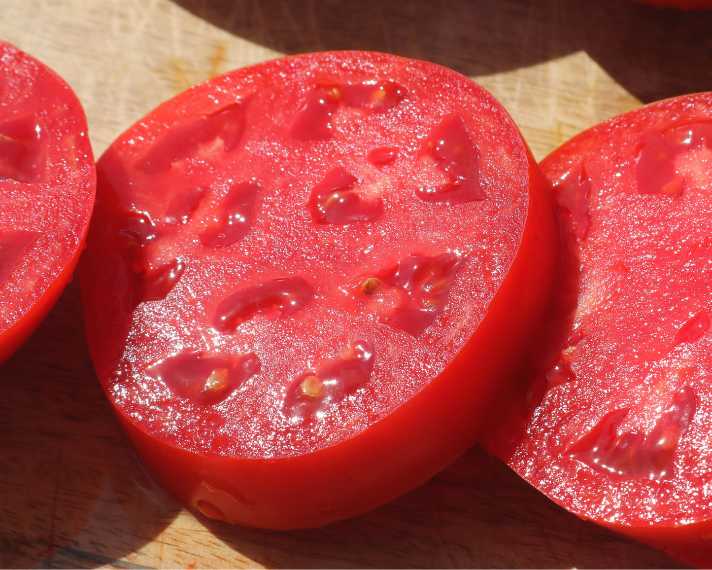 Packet of Seeds 'n Such Jamestown Hybrid Tomato Seeds showing 8 to 10 seeds in the packet.