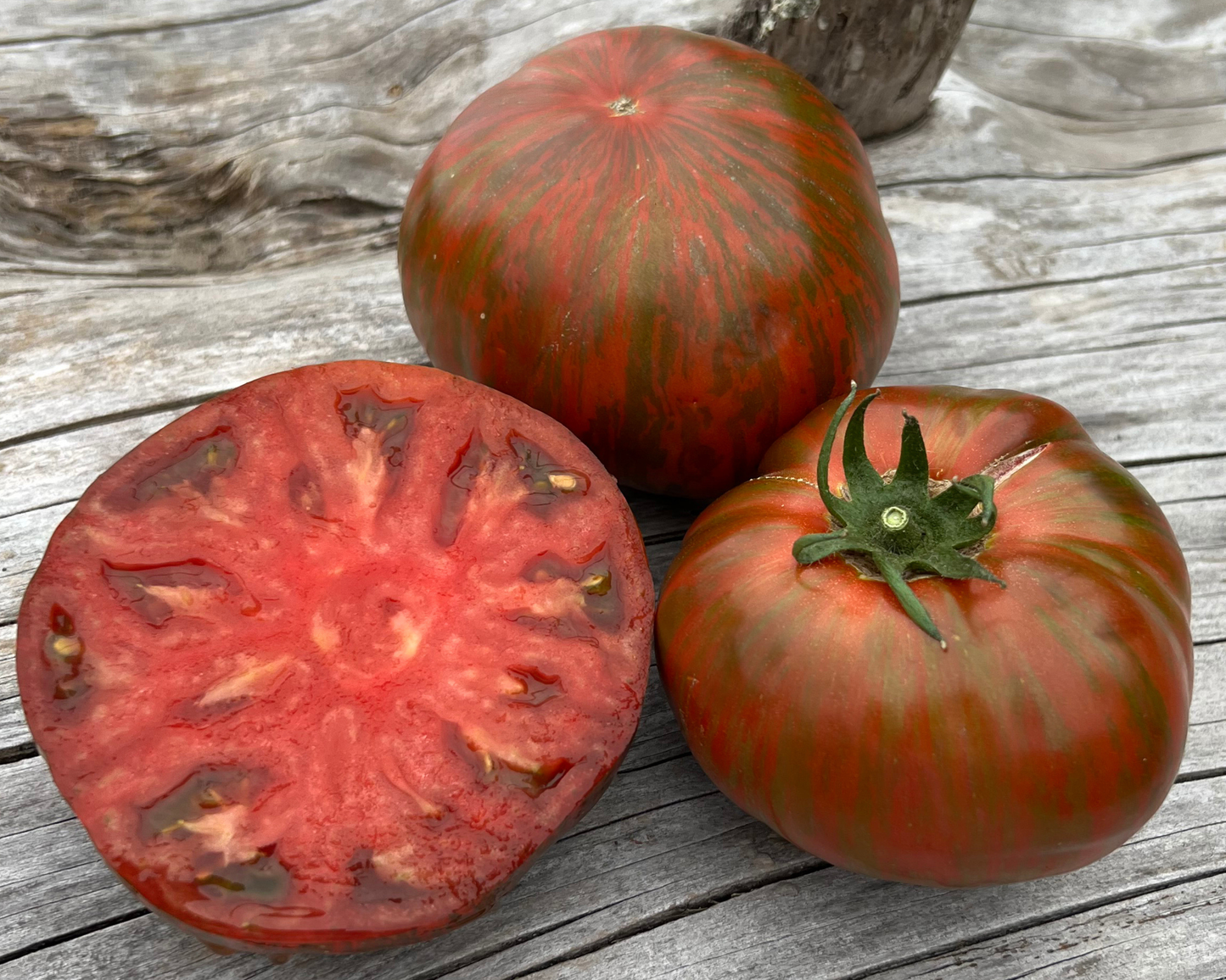 Bulk Beefy Purple Tomato Seeds from Seeds 'n Such, showing 100 seeds in a clear packet for planting and gardening.