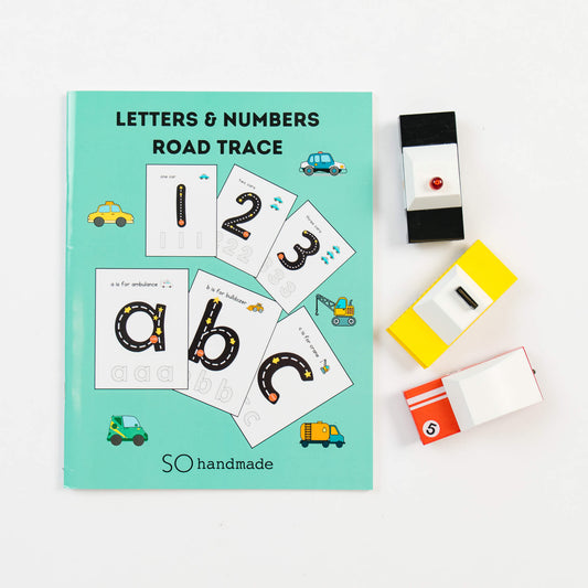 Coloring page from So Handmade Shop's Road Trace Activity Book with alphabet and numbers for kids' learning.