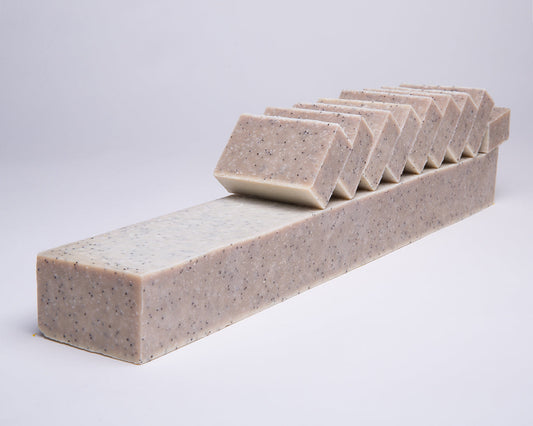 Bar of Soap for Sinners with salt, seaweed, and eucalyptus, featuring a natural, textured soap bar with botanical ingredients.