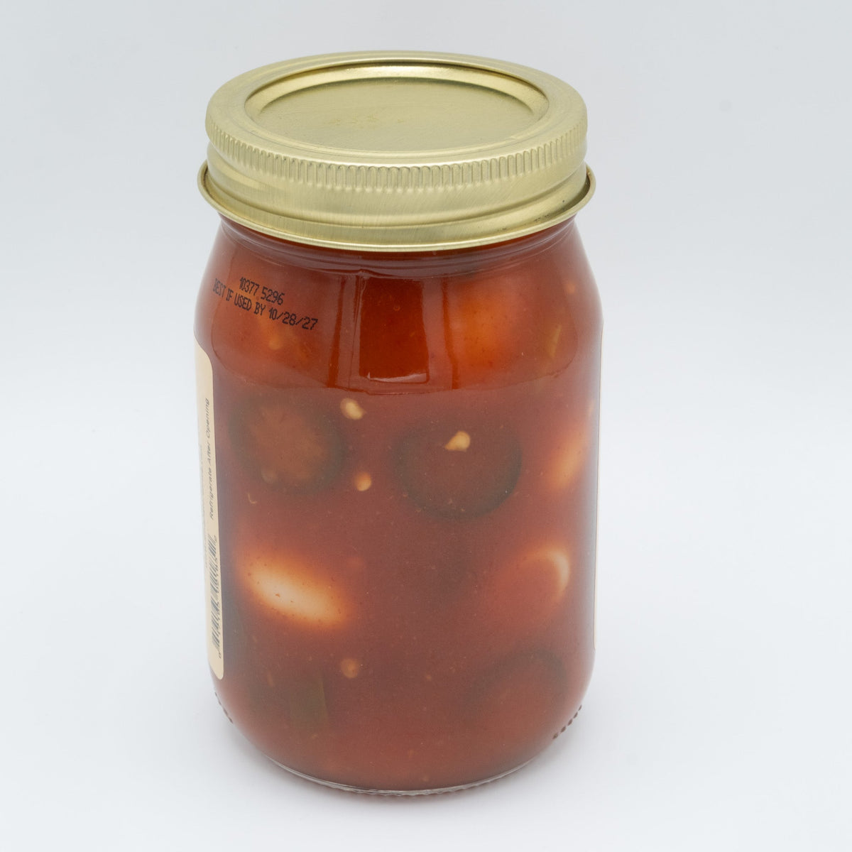 Canned Pickled Sriracha Quail Eggs in a jar, spicy and tangy snack from Amish Country Store with bright red sriracha sauce visible.