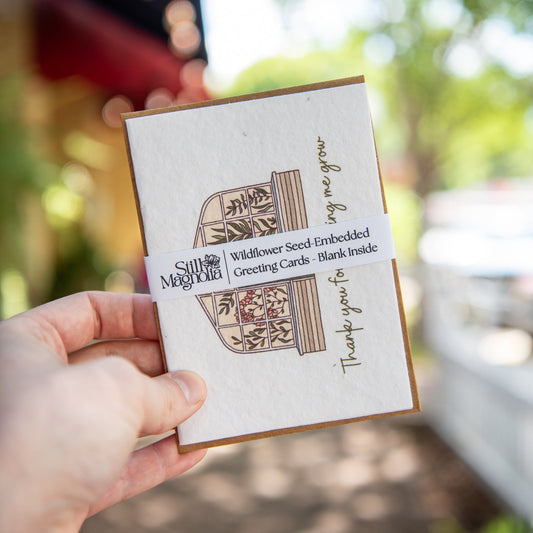 Thank you Still Magnolia plantable seed card with "Thank You For Helping Me Grow" message, featuring floral illustrations.