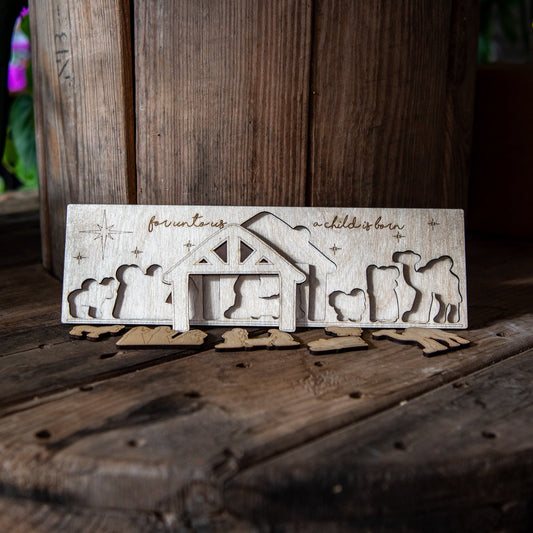 Children's Nativity wood puzzle by Still Magnolia featuring colorful, interlocking wooden pieces for festive holiday activity.