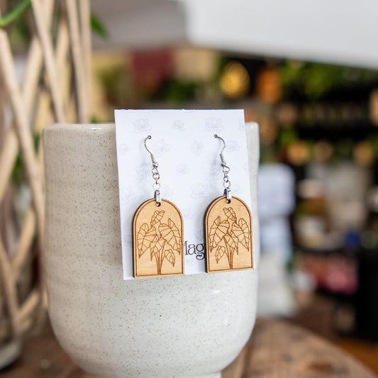 Still Magnolia Alocasia Arched Earrings featuring elegant leaf-shaped design in silver with intricate detailing.