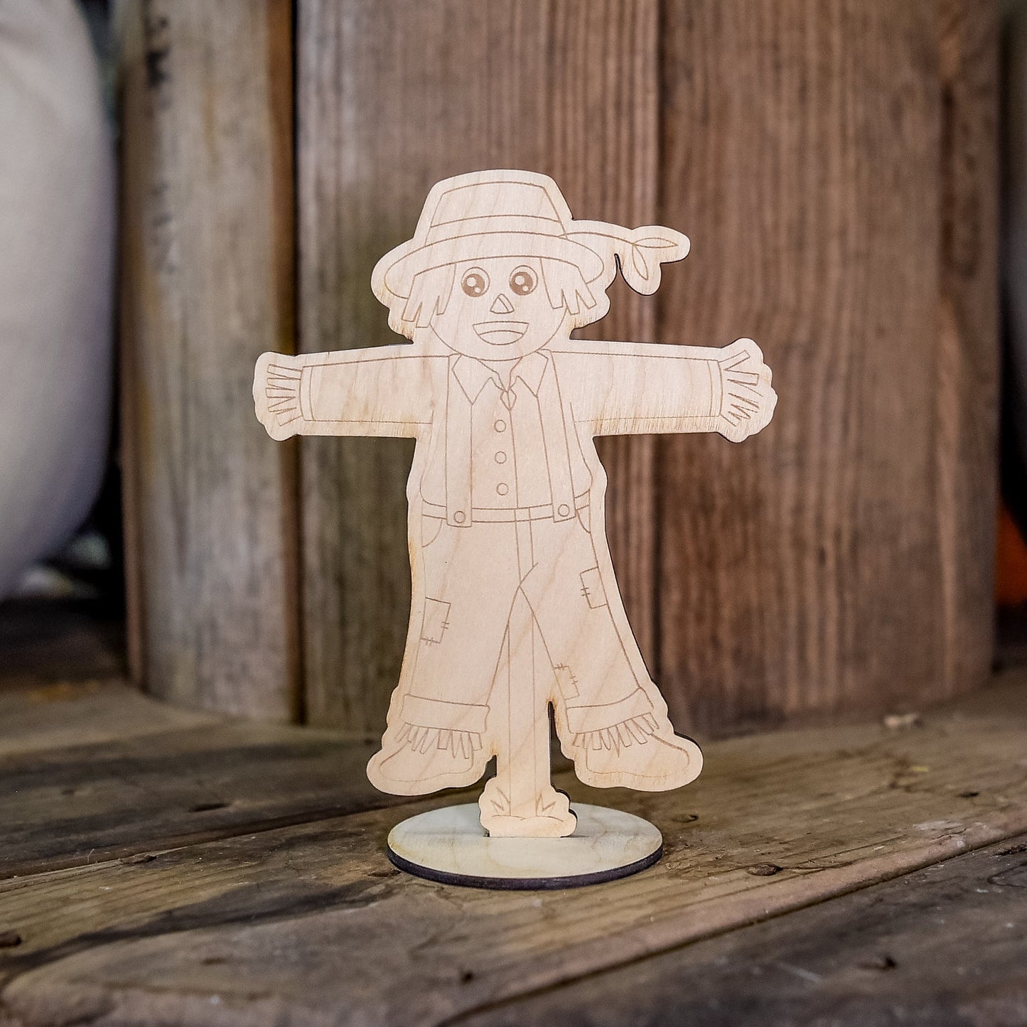 Kids painting kit featuring a fall scarecrow craft by Still Magnolia, includes colorful materials for creative autumn art projects.