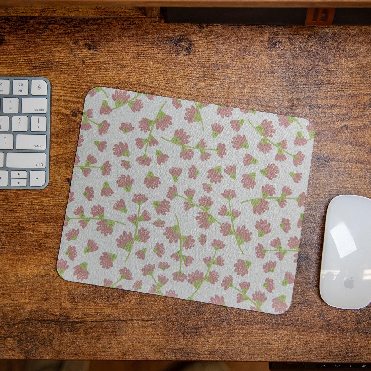 Still Magnolia purple floral mouse pad with vibrant floral design, smooth surface, and non-slip base for comfortable use.