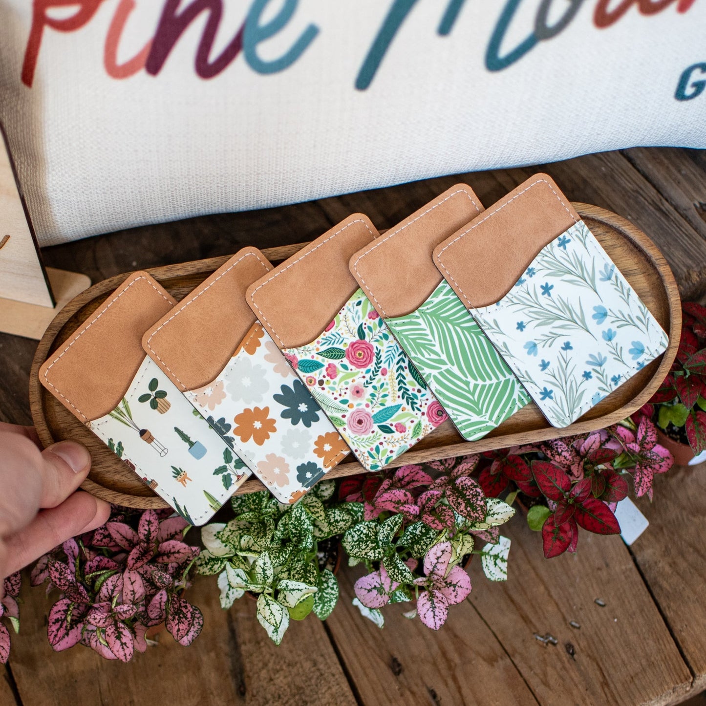 Still Magnolia Wildflower Whisper Pattern phone wallet with floral design and card slots, made of durable material.