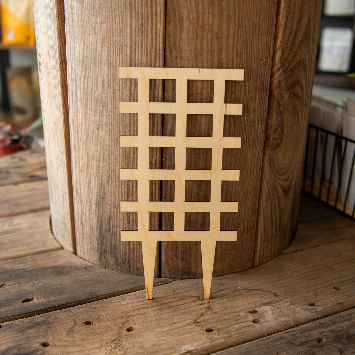 Still Magnolia plant trellis grid, a metal garden support for climbing plants and vines, with a sturdy grid design.