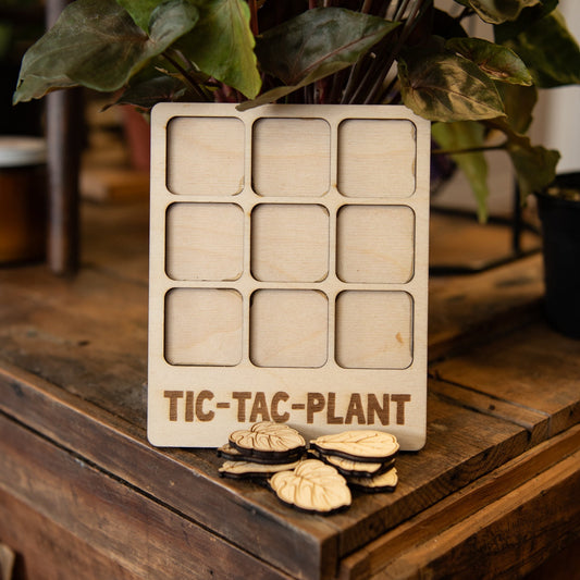 Still Magnolia Tic-Tac-Plant puzzle showing colorful illustrated plant-themed puzzle pieces and box.