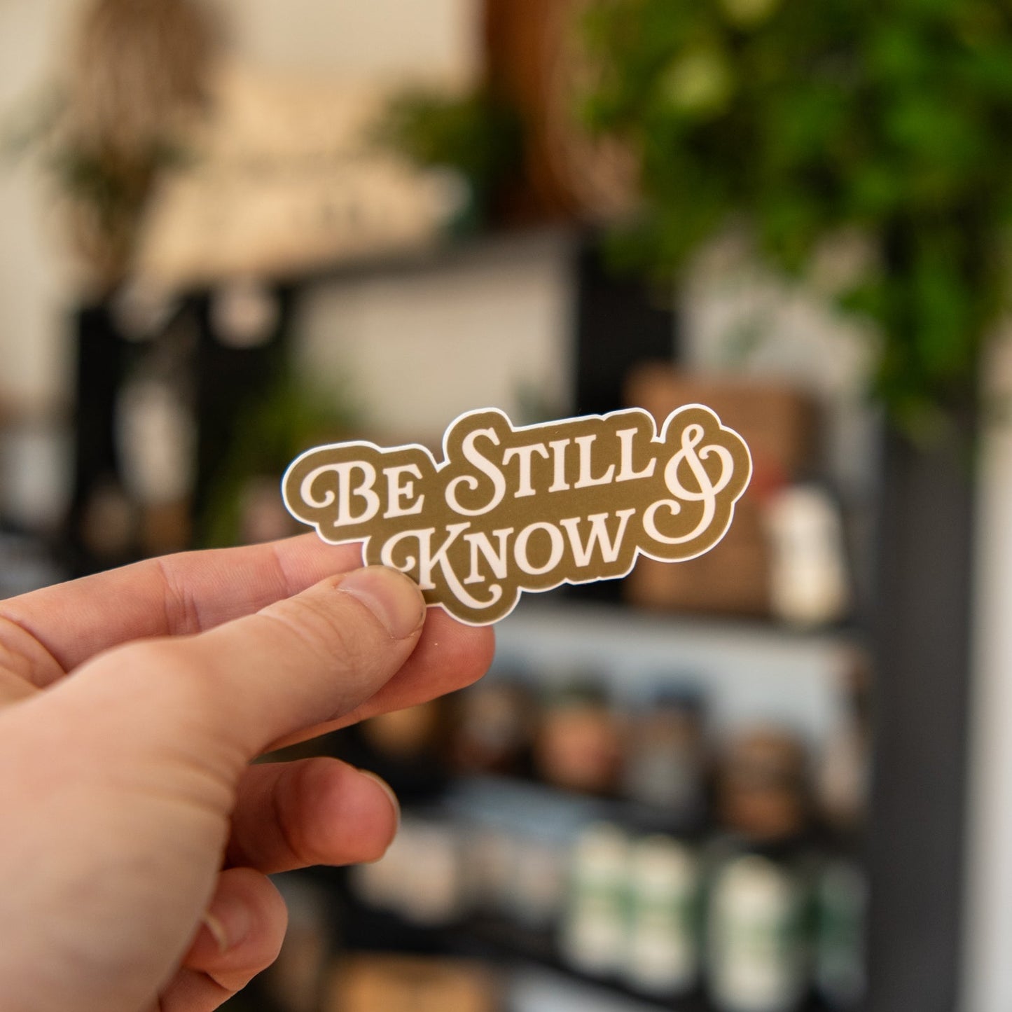 Still Magnolia Be Still & Know sticker featuring a colorful, inspirational design on a rectangular sticker for decorating surfaces.