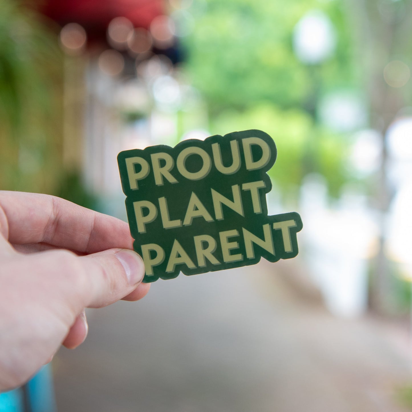Proud Plant Parent sticker by Still Magnolia featuring a colorful design of a happy plant and decorative elements.