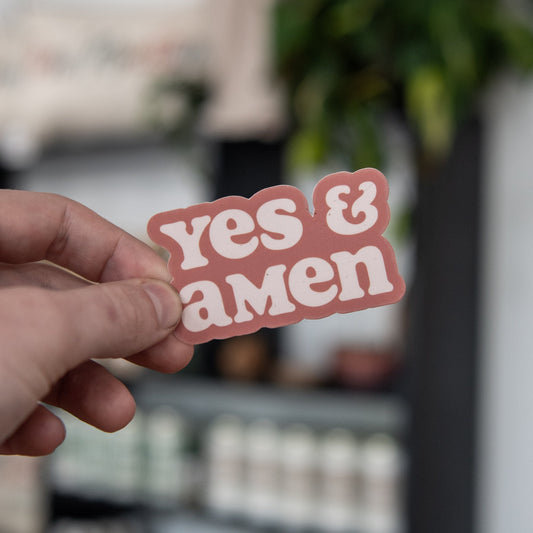 Still Magnolia Yes & Amen sticker featuring bold text on a colorful background, perfect for decorating notebooks or laptops.
